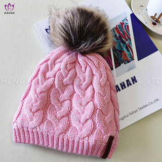 HA35 Knitted hat with wool ball.