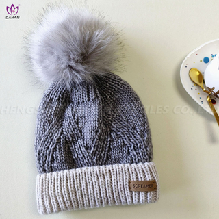 HA15 Knitted hat with wool ball.